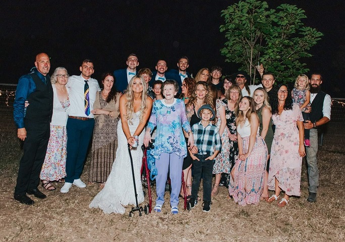 Joey and Arika’s wedding. Danny top right cheers-ing the camera.